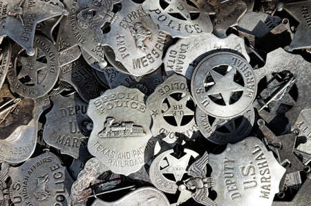 A pile of badges at a street marketの写真素材