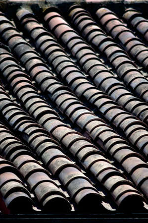 Rows of roof tiles in early morning lightの写真素材