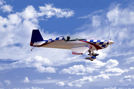 aerobatic aircraft against a cloudy sky