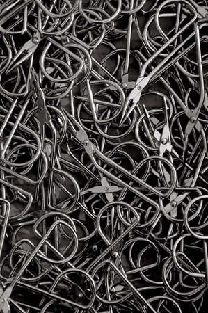 A tray full of stainless steel tweezersの写真素材