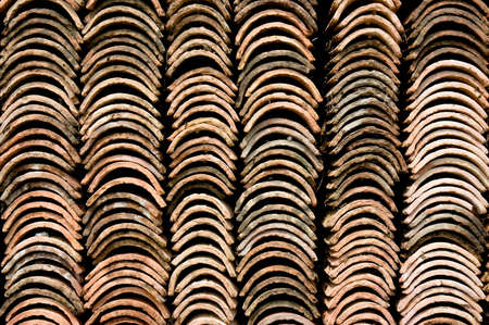 Rows of stacked terra cotta roofing tiles.の写真素材