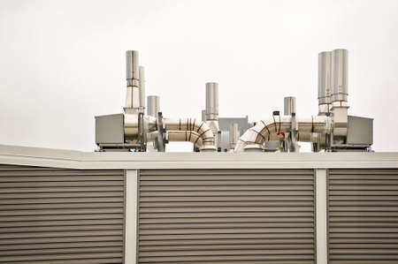 Clean air handling equipment on top of a building with striped panel sides.の写真素材