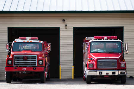 Two firetrucks parked and ready to rollの写真素材
