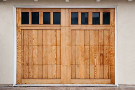 Carriage style garage doors of a contemporary home.の写真素材
