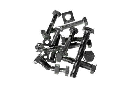 A closeup of assorted nuts and bolts against a white background.の写真素材