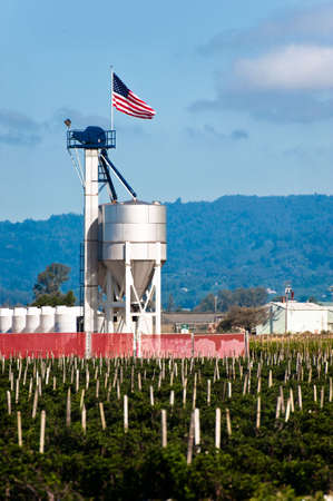 A fertilizer blending tower with an American flagの写真素材