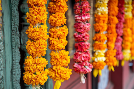 Colorful Marigold flower garland hanging in the temple.の写真素材