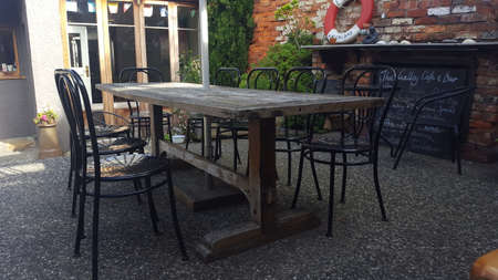 Wooden table and chairs in a cafe in the city of Gdansk, Polandの写真素材