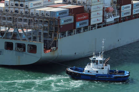 Cargo ship enters the port.