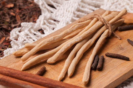 Grissini (Thin Bread Sticks) on wooden cutting board