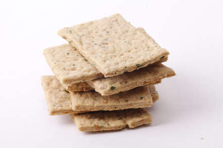 Dry thin lemon leaves crackers. Tasty crispy crackers isolated on white backgroundの写真素材
