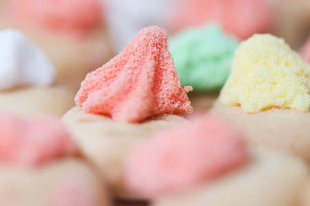 Belly button iced gem biscuits on white background