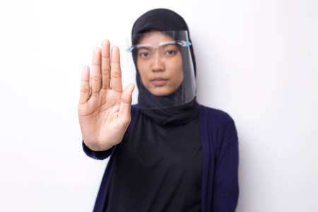 Young asian muslim woman with a face shieldの写真素材