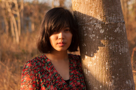 Young woman relaxing in summer sunset sky outdoor.
