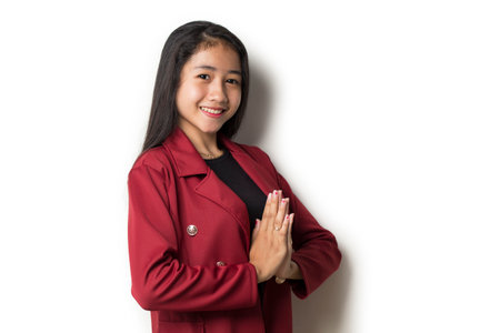 Asian business woman welcoming guests gesture on white backgroundの写真素材