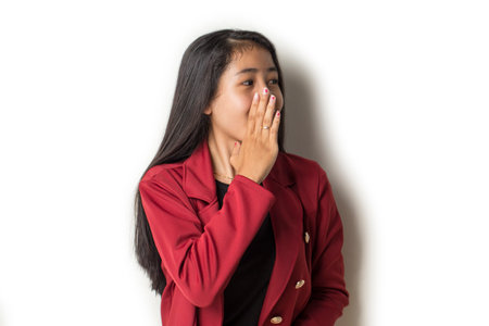 Portrait of young Asian muslim woman wearing hijab shouting and yelling