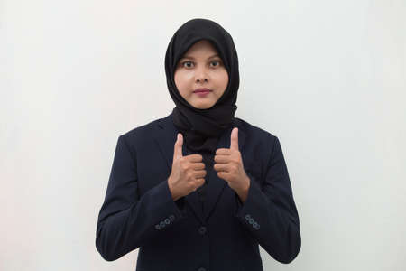 Asian muslim woman wearing hijab with ok sign gestureの写真素材