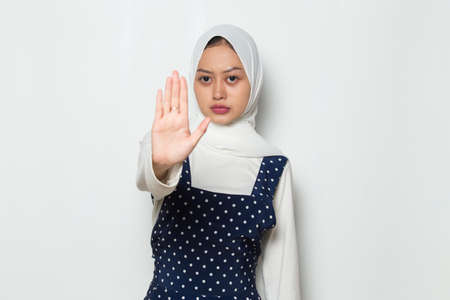 Asian muslim woman show stop hands gestureの写真素材