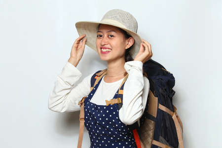 Asian woman tourist isolated on white backgroundの写真素材