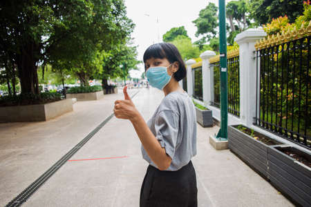 Asian woman wearing medical mask travel around public places