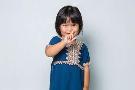 Asian little girl making stop gesture with her handの写真素材