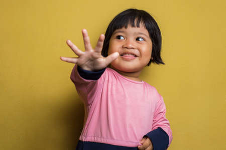 Asian little girl making stop gesture with her handの写真素材