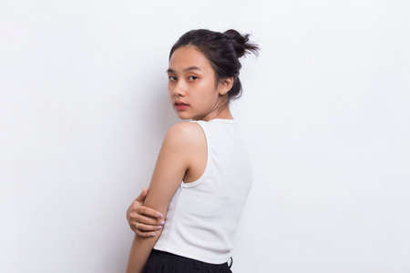 portrait of beautiful young asian woman with clean and fresh skin isolated on white backgroundの写真素材