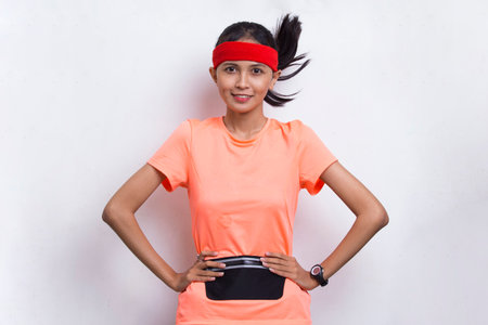 portrait of young beautiful asian sport woman on white background