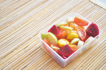 Box of tropical fruit saladの写真素材