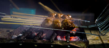 Grilled meat is ready to be eaten with friendsの写真素材