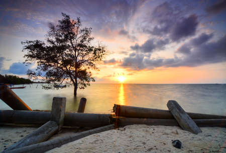 Beautiful sunset in the fishing village of Batam island, Indonesiaの写真素材
