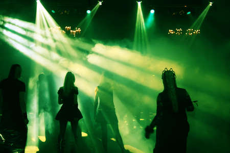 Silhouettes of a dancing teenagers