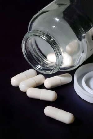 Bottle of white pills
