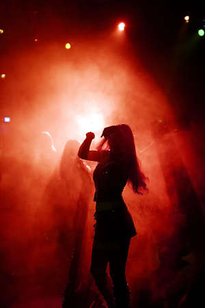 Dancing people in an underground clubの写真素材