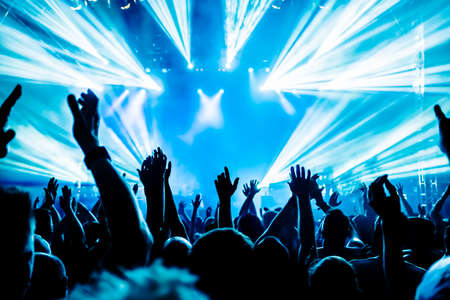 Cheering crowd at concert rock concertの写真素材