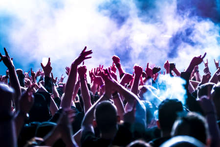 cheering crowd at a rock concertの写真素材