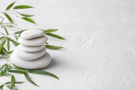 Photo of a stack of balanced stones with bamboo leaves on a white background, a spa concept banner, space for text, mockup design, natural colors, stock photo, simple composition, feminine, soft light, shot in the style of floral minimalism, soft edges and atmospheric effects, white background, stock photography, copy space, high resolution. --ar 3:2 --v 6.1 Job ID: a67f3c78-548c-465b-8821-b9f3a4e043ceの素材