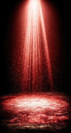 Red light beams shine down on a glittering, dusty stage floor.の素材