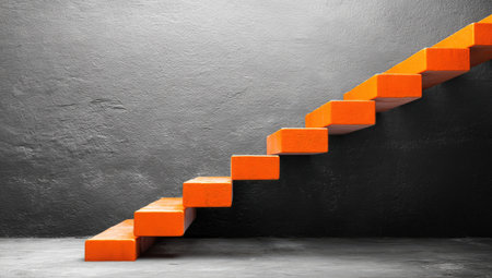 A modern, minimalist staircase with bright orange steps against a dark wall.の素材