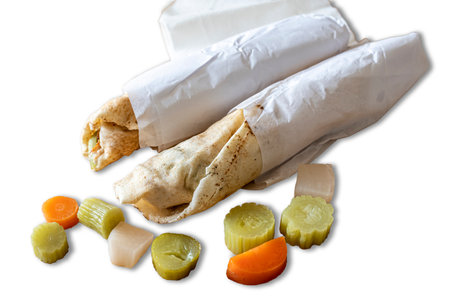 Fresh shawarma sandwiches with vegetables pickles ready to eat isolated on white background, Arabic foodの写真素材