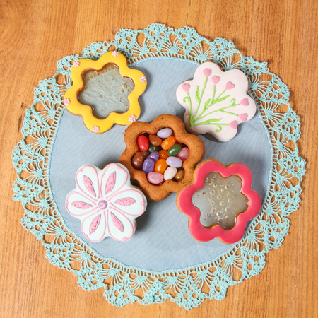 Homemade Ginger Cookies in the shape of Jewelry box on the blue napkin on wooden background. Closeup view, square pictureの写真素材
