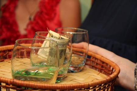 glasses with money on a bartender and peopleの写真素材