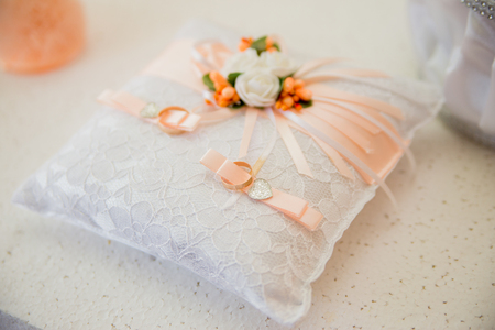Wedding gold rings on the cushionの写真素材