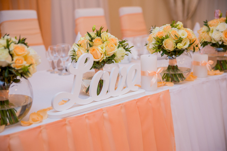 Wedding table with the inscription love on the tableの写真素材