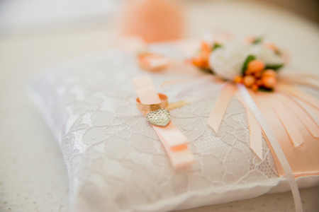 Wedding gold rings on the cushionの写真素材