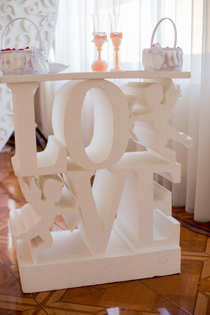 table with inscription love at the wedding ceremonyの写真素材
