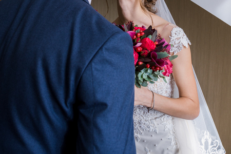 the bride and groom are standing nearbyの写真素材