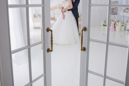 bride and groom sit together on the bedの写真素材