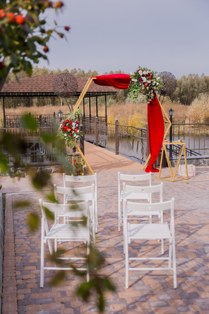 arch and chairs for a wedding ceremony in the parkの写真素材