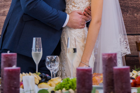 bride and groom hugging at the wedding banquetの写真素材